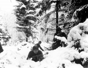 Men of US 290th Infantry Regiment in snowy terrain near Amonines, Belgium, 4 Jan 1945. (US Army)