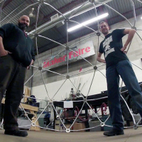Kevin Loney (right) and Jim Akeson with completed Argus dome frame. Not pictured: Shannon Wheeler.