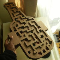 The handheld handmade marble maze game