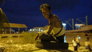 Ferry captain in Yangon -- and cell phone photograper