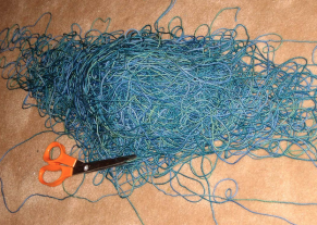 Cut it into tiny pieces to set it free. Then throw it out.