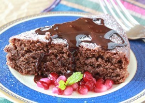 Flourless Chocolate Cake with Fudge Sauce and Pomegranate Seeds