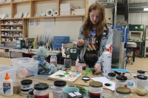 Mollie creating glass art