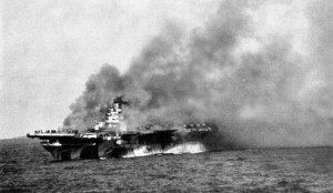 USS Ticonderoga burning after being hit by two kamikazes, 21 Jan 1945. (US Navy)