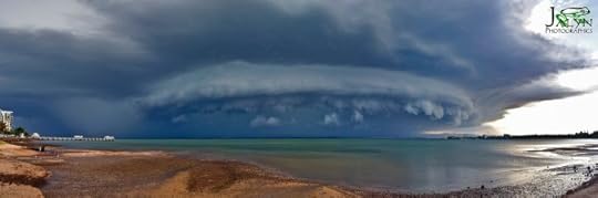 photo of jellyfish shaped storm cloud over water