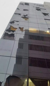 Glass Office Building With Broken Panels