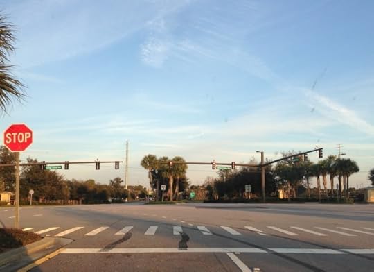 The intersection of Flamingo Crossings Boulevard and Western Way currently is a four-way stop with next to no traffic, but traffic lights, multiple lanes, and designated crosswalks predict more activity in the future. (Photo by Julia Mascardo)