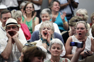 People shout at a town hall meeting on healthcare reform hosted by Rep. Mike Coffman (R-CO) in Littleton