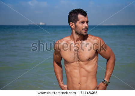 stock-photo-young-handsome-muscular-man-standing-in-blue-water-looking-away-71148463