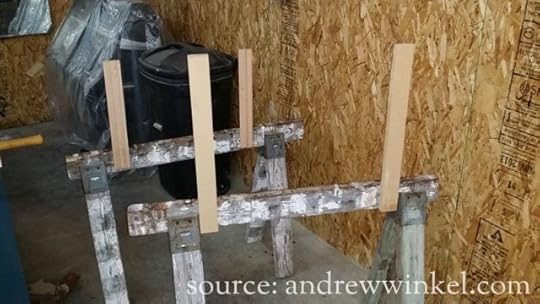 Tacking scrap wood to saw horses let me slide the legs onto them like sleeves so I could apply the finish coat.