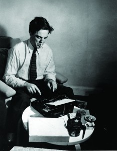 Folklorist Alan Lomax at work at his manual typewriter, 1942.
