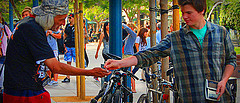 Man giving man coins
