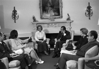 President Richard Nixon meets in his office at the White House in Washington , May 15, 1972, with representatives of the National League of Families of American Prisoners and Missing in Southeast Asia. In attendance are, from left: Gen. Brent Scowcroft, presidential Air Force aide; Maureen A. Dunn of Randolph, Mass.; Sybil E. Stockdale of Coronado, Calif.; Nixon; Phyllis E. Galanti of Richmond, Va.; and Henry Kissinger, assistant to the president. (AP Photo/John Duricka)