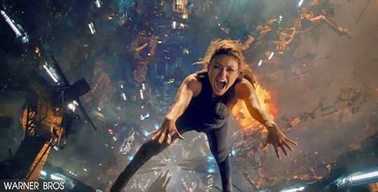 Mila Kunis, a white woman with brown hair wearing a vest and close-fitting leggings, falls into a technological abyss.