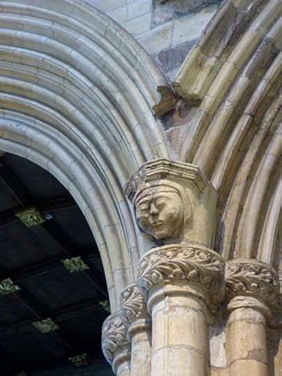 Details and curious characters cover the stonework