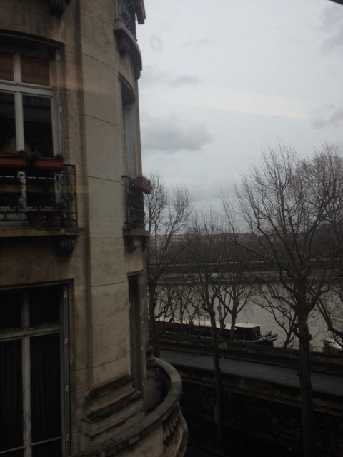 The Eiffel tower is right there - behind the building. 