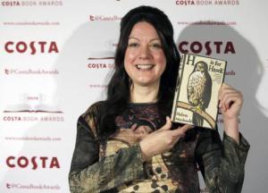 Helen MacDonald, nominee in the 2014 Costa Book Awards and winner of the Costa Biography Award category, poses with her book 