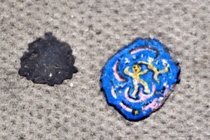 Two gum splotches side by side, one of which has been painted by street artist Ben Wilson. (Art © Ben Wilson; photo © Sheron Long) 