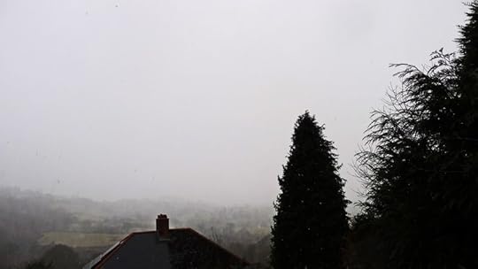 The view out of the studio windows, snow obscuring the valley