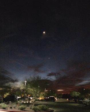 Crescent moon moving closer to Venus on a dark, February night. I saw it because I was outside. In the dark. 