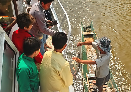 Buying fresh fish on the Mekong River