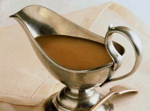 A silver tureen of delightful brown gravy. Chockful of drippings, don't you know. 