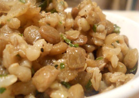 A plate of grey and brown Lentils and Rice without flavor or delight.