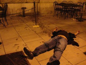 A frat boy, passed out in a pool of mysterious fluid that may or may not be vomit. 
