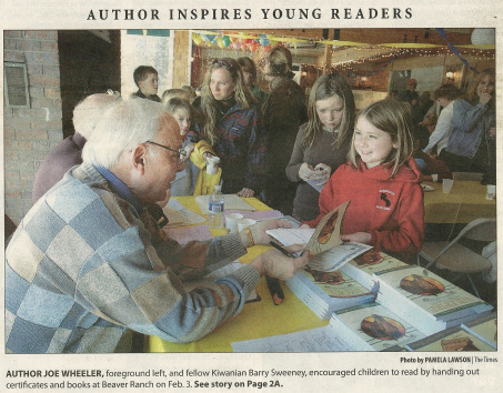 Author Joe Wheeler, foreground left, and fellow Kiwanian Barry Sweeney, encouraged children to read by handing out certificates and books at Beaver Ranch on Feb. 3, 2007.