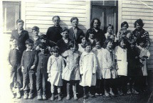 The entire school as it was, many years ago. Miss Costello was teacher. I���m in the front row.
