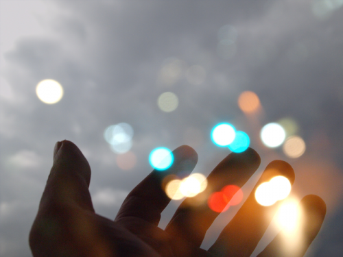 Hand with inspirational lights