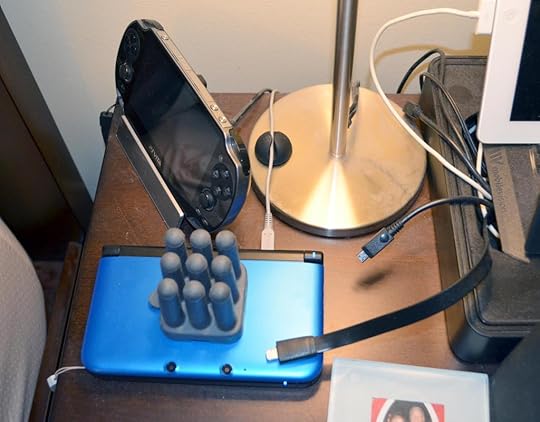 The CableButton does a great job keeping the charging cable attached to my Nintendo 3DS XL on my nightstand. Note that rubbery grey thing on top of the 3DS XL. That was my prior cable management solution I got from a Kickstarter. The CableButton is better.