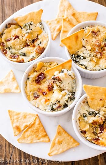 Creamy warm spinach dip made with roasted garlic, crispy bacon, and parmesan cheese. This dip was gone in minutes! Recipe on sallysbakingaddiction.com
