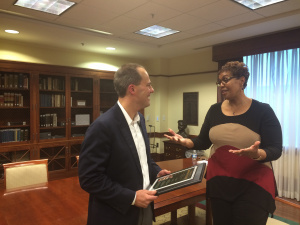 Cassandra gives me a plaque commemorating The Professor's selection for the book club.