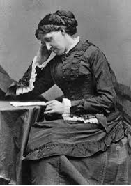 Louisa May at her desk.