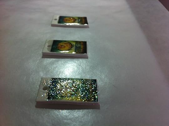 This shows you a Fail Box. The nearest one has holographic embossing powder on it, which sounds great but looks like crap. The other two have the embossing powder I linked to. It's far superior to any other in my arsenal.