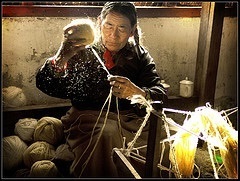 Man spinning wool