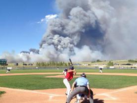 It's not rain, but a forest fire behind a high-school game in Colorado. I found it randomly.
