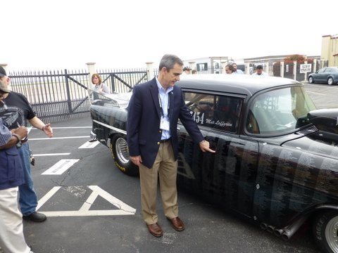 At the Freedom Flyer reunion (560FTS Randolph AFB) Lee pointing to his name on a 55 Chevy that contains the names of all POWs and MIAs from South East Asia.