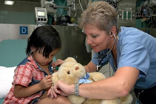 US Navy Project Hope nurse listens to a child's heartbeat while taking her vital signs. US Navy photo by Photographer's Mate 2nd Class Erika N. Jones. Public domain via Wikimedia Commons.