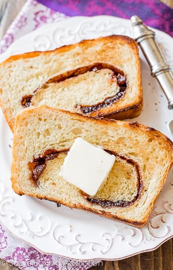 Homemade Cinnamon Raisin Swirl Bread-- It's soft and tender with the most unbelievably gooey cinnamon swirl inside!