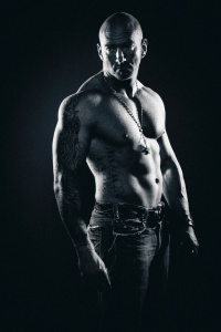 black and white portrait of shirtless muscular man