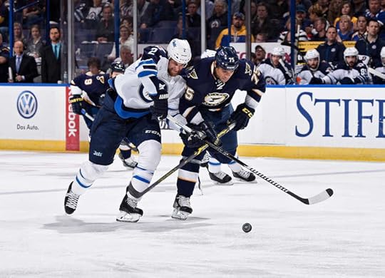 Adam Pardy battles with Ryan Reaves.