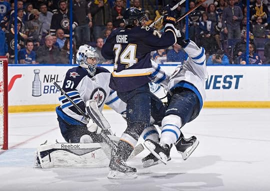 T.J. Oshie and Mark Stuart mix it up in front of Pavelec. This game was mean.
