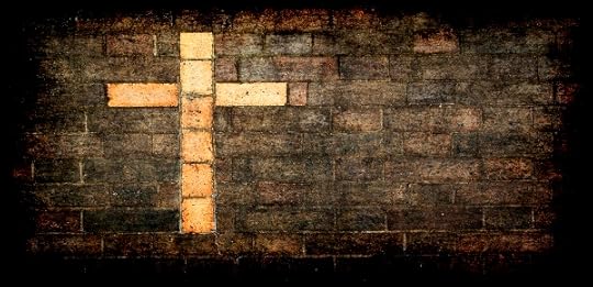 cross of christ built into a brick wall