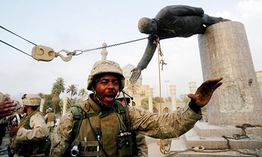 US marines pull down a statue of saddam hussein on