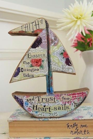 http://gardengalleryironworks.com/collections/decorative-decor/products/wooden-boat-faith