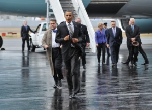 US President Barack Obama jogs over to g