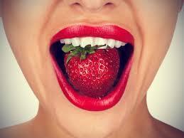 strawberry in mouth with smile