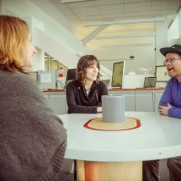 Noah Feehan meets with Alexis Lloyd (left) and Jane Friedhoff around the New York Times' Listening Table